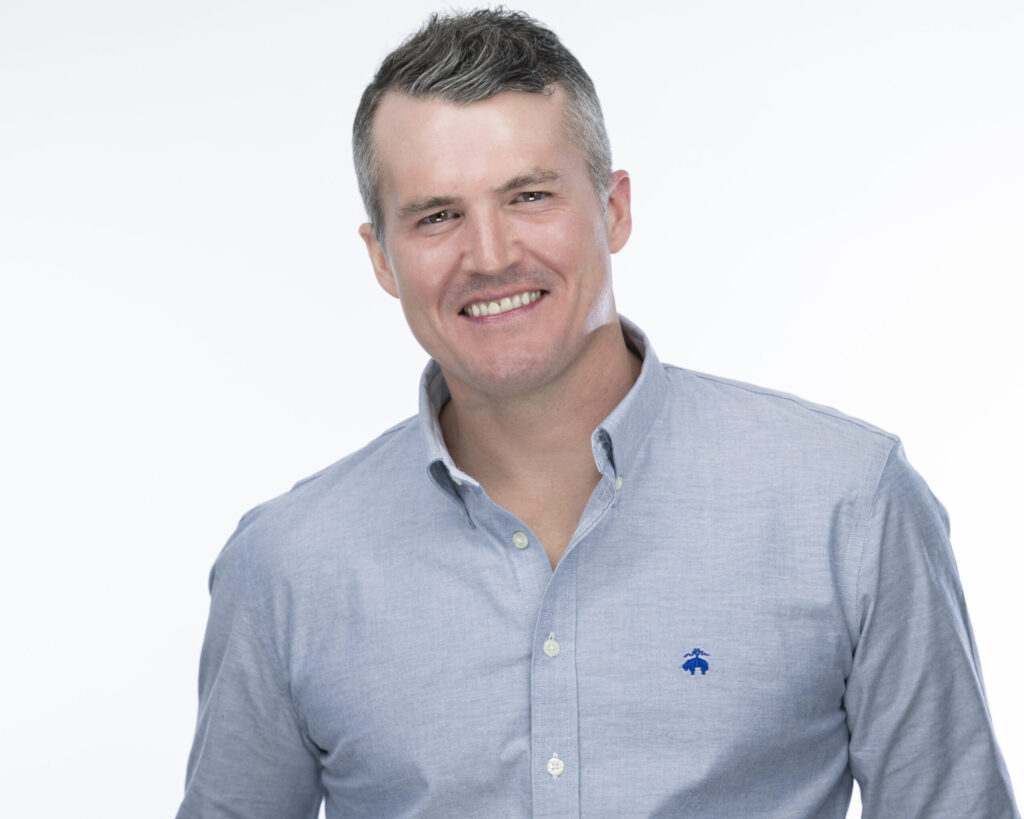 Suffield, CT, Northern Connecticut and Western Massachusetts Professional Headshots Photographer | Casual Look Headshots With Personality | Man on white backdrop posing for Linkedin Photos