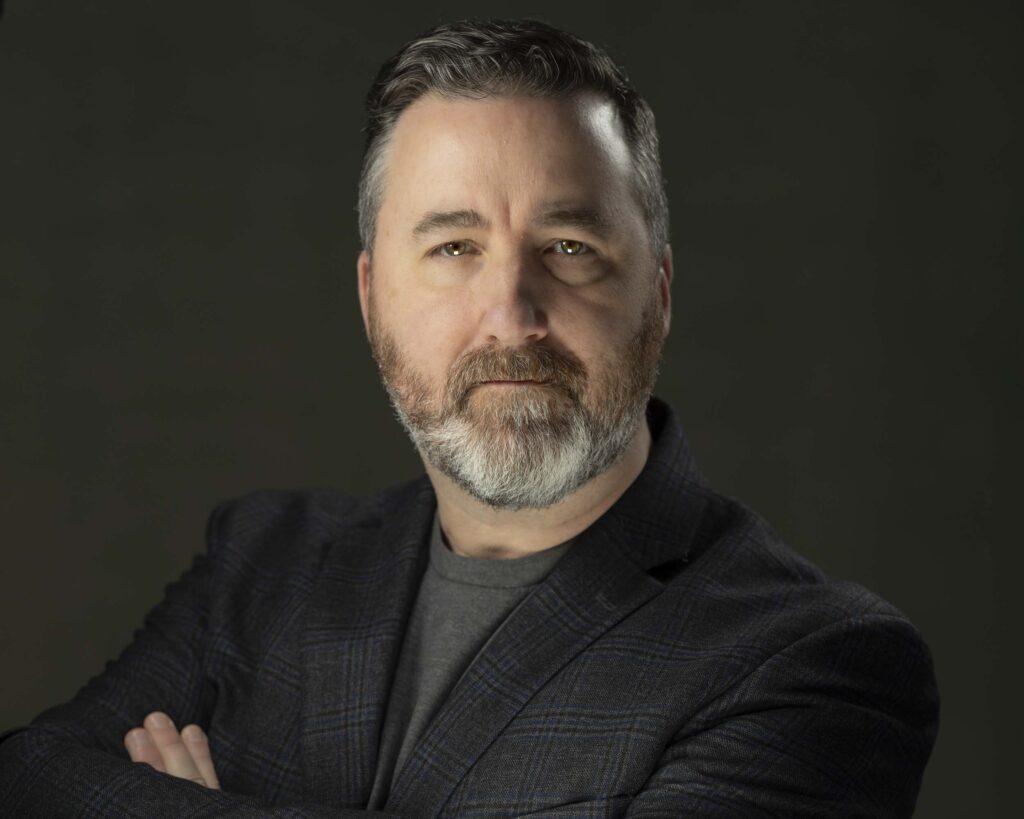 Avon Photography | Professional Headshots in CT | Avon Headshots | Man standing with arms crossed posing for professional headshots.