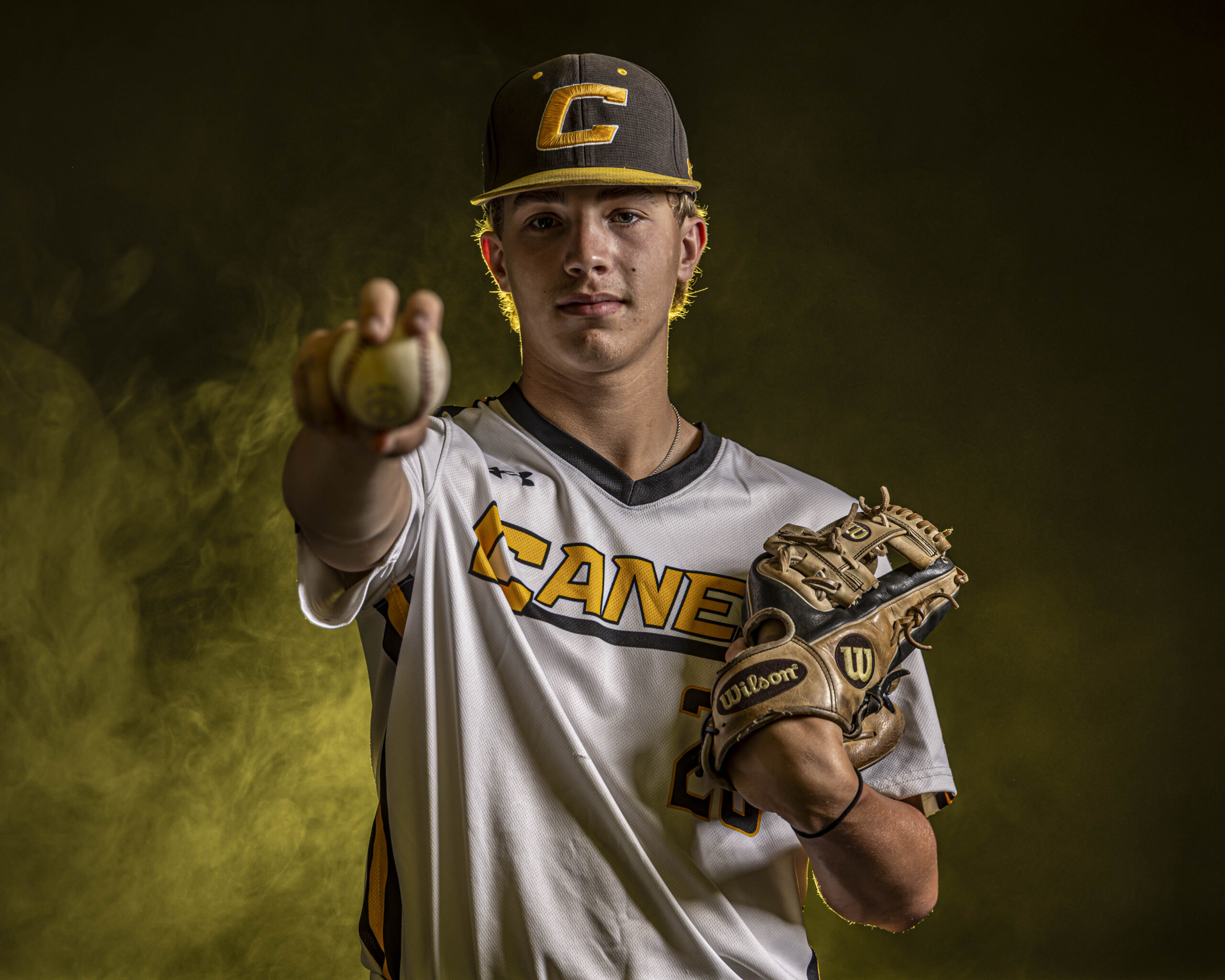 CT Media Day Photographer | MA Media Day Photos | CT photographer - Baseball Player with white shirt and Canes logo holds ball