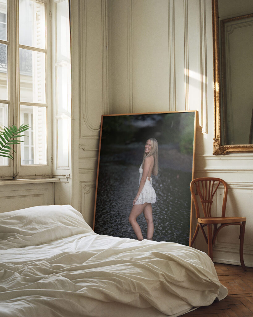 Rob Faber Photography | CT Senior Photographer | Fine-art senior portrait displayed as framed wall art in an elegant bedroom, featuring a high school senior in a white dress photographed outdoors in Connecticut.