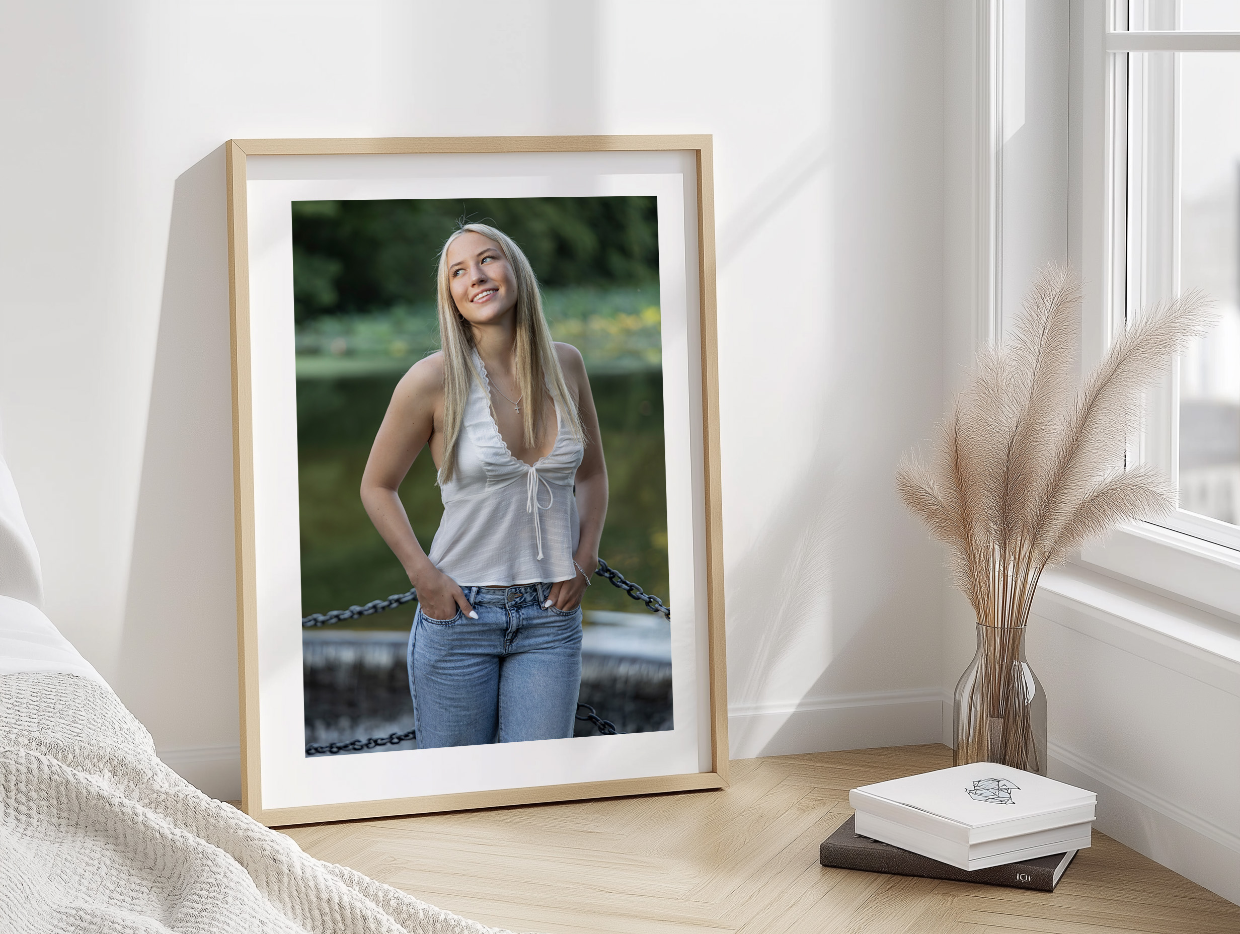 Rob Faber Photography | Senior Portraits | Senior Photos | Framed senior portrait displayed as wall art in a bright, modern home, showcasing a confident high school senior photographed outdoors in natural light.