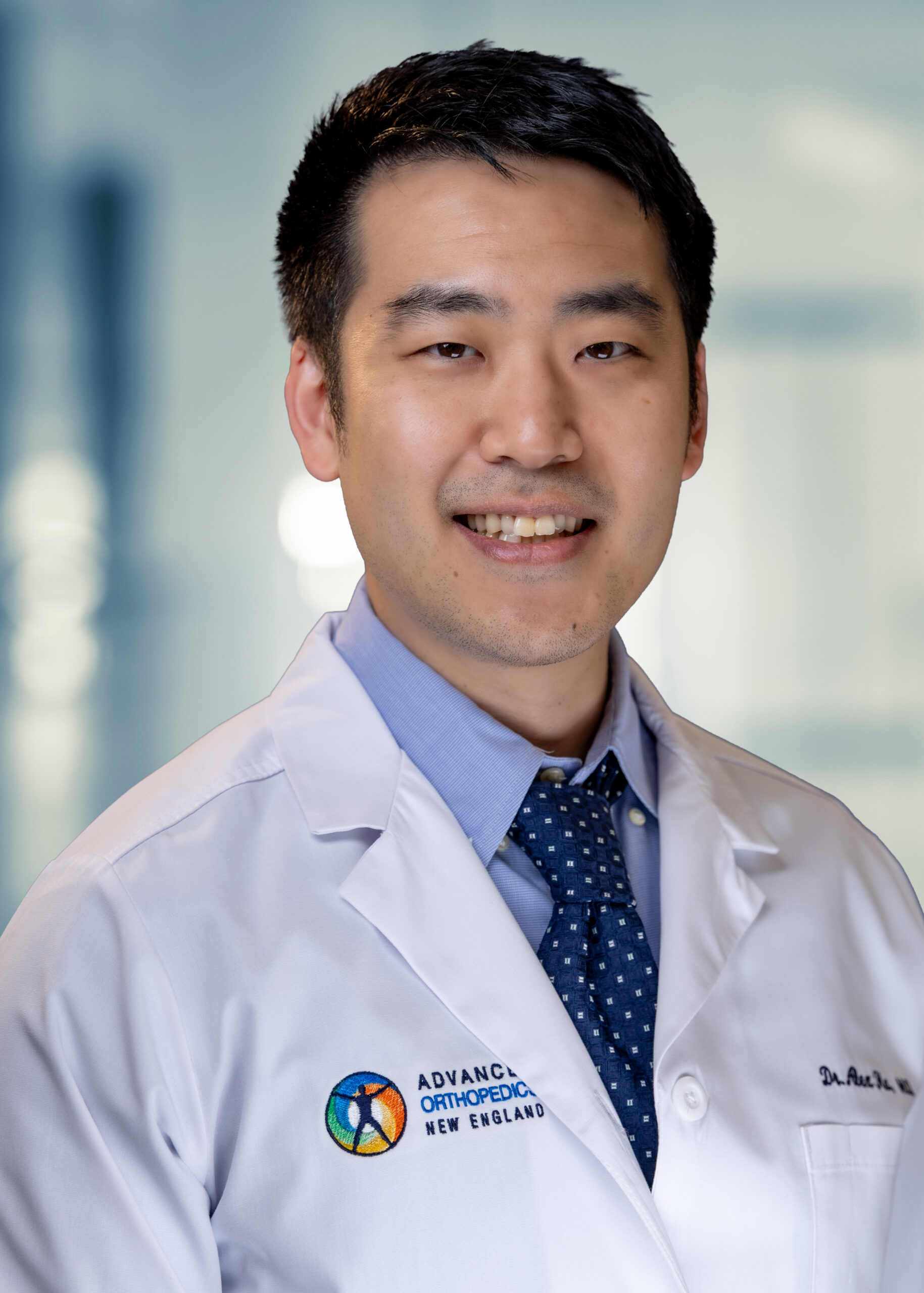 Rob Faber Photography | CT Headshots | Headshots CT professional medical headshot of a doctor in a white lab coat, photographed with clean natural light and a confident, approachable expression for professional use