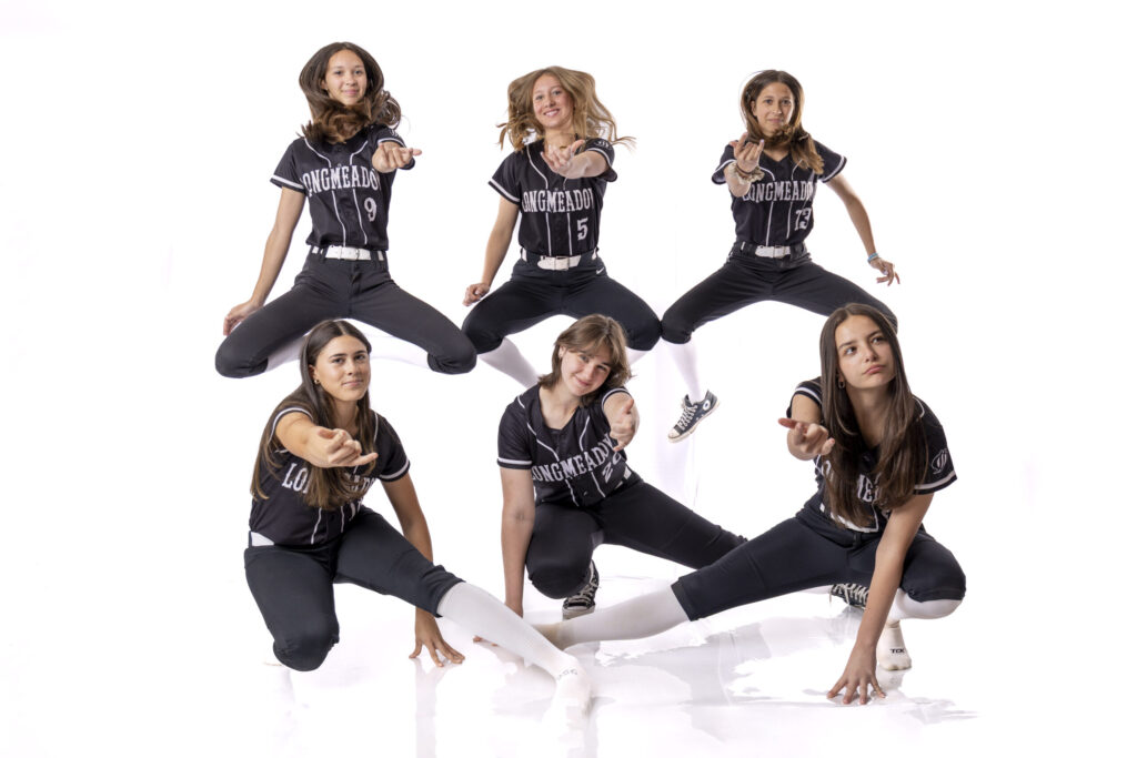 FBR Media | Rob Faber Photography | CT Photographer – Longmeadow MA softball players creating a dynamic jumping Spiderman group pose during Media Day Session in MA