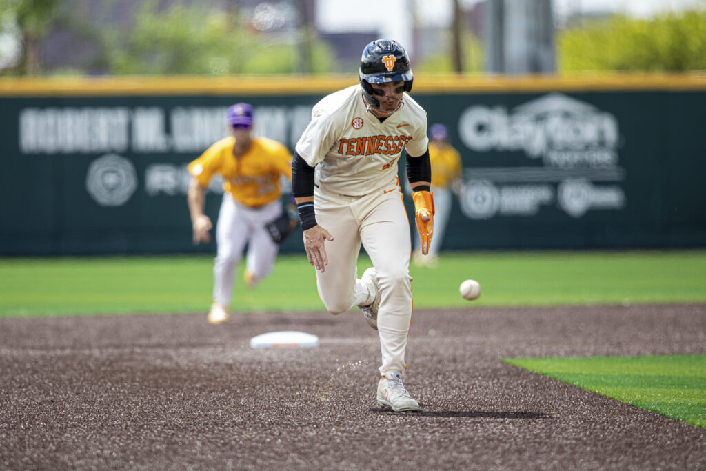 Rob Faber Photography | University of Tennessee Sports Photographer | Tennessee baseball player running with focus and intensity during game action