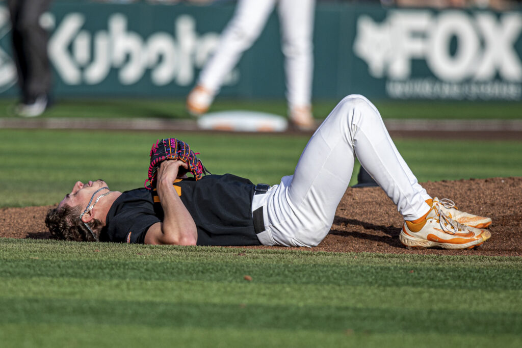 Rob Faber Photography | FBR Media Group | University of Tennessee Sports Photographer | Tennessee pitcher lying on mound showing raw emotion during LSU game