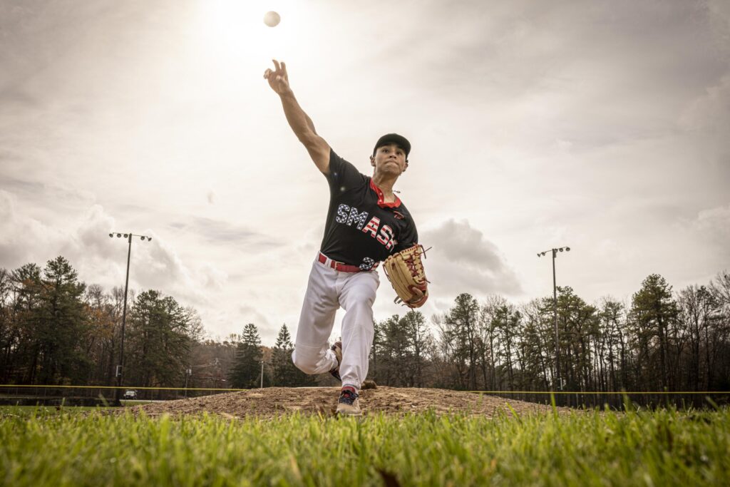 Rob Faber Photography | FBR Media | Senior Guys Portraits | High school baseball pitcher throwing during a sunset athletic senior portrait session in Connecticut