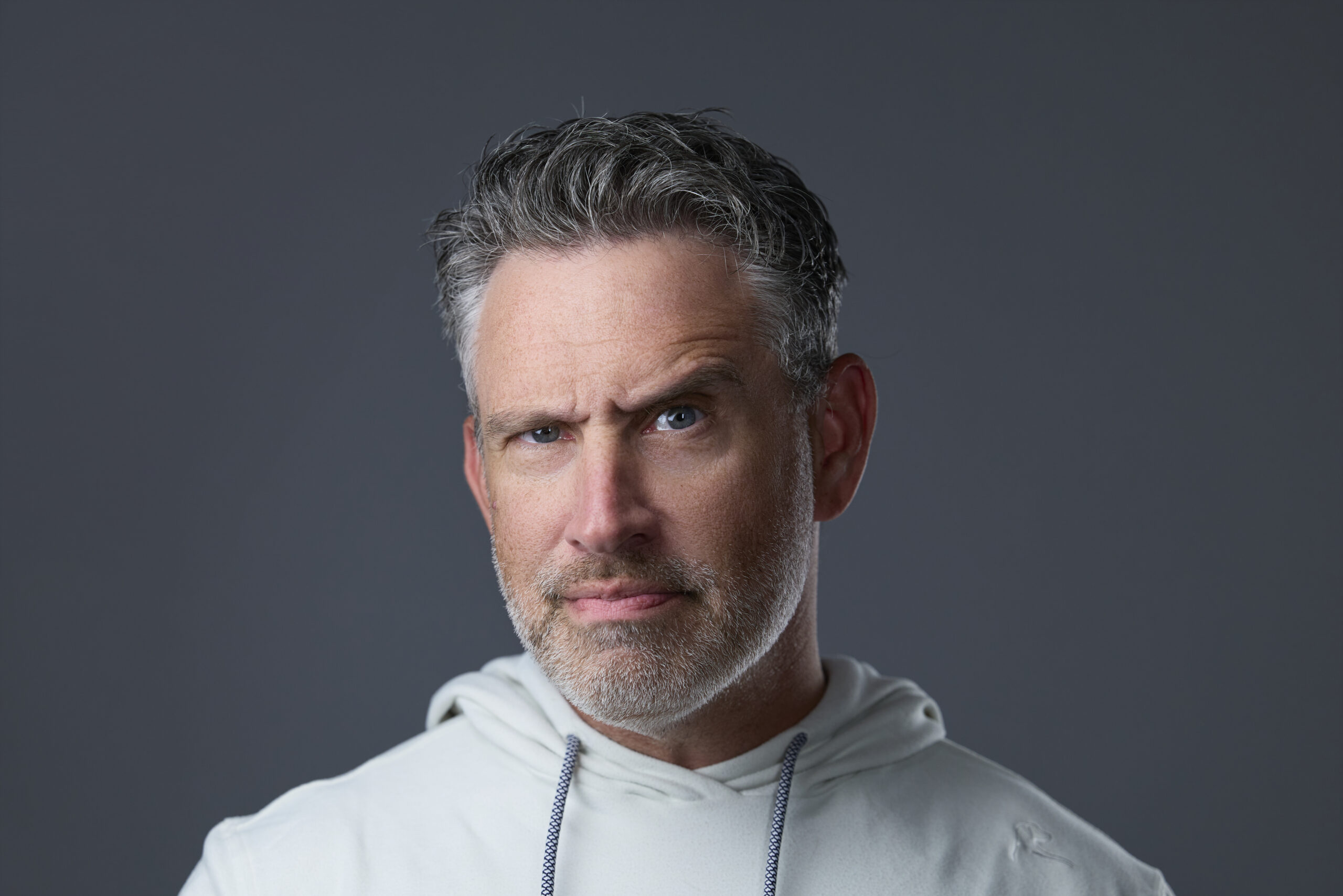 Rob Faber Photography | Self Portrait | headshot Psychology | Man with salt and pepper hair and beard poses with one eyebrow up.